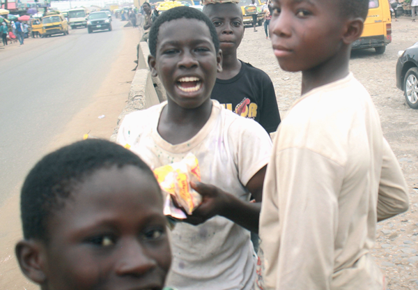 These boys could not continue their education due to funds, to survive they sell snacks along Sango – Abeokuta expressway.