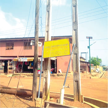 Far right is a stand alone solar street light at Iwalewa, Akure South, Ondo State.