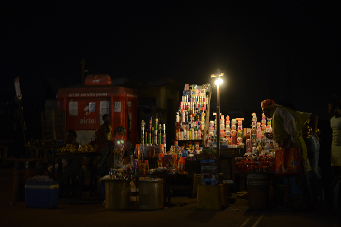 Petty trader rely on small generator to light up her wares at Pen Cinema, Agege, Lagos October 1, 2017.