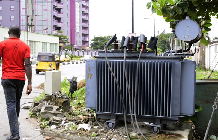 A man walks past unfenced transformer at Bishop Aboyade Cole, Victoria Island September 13.
