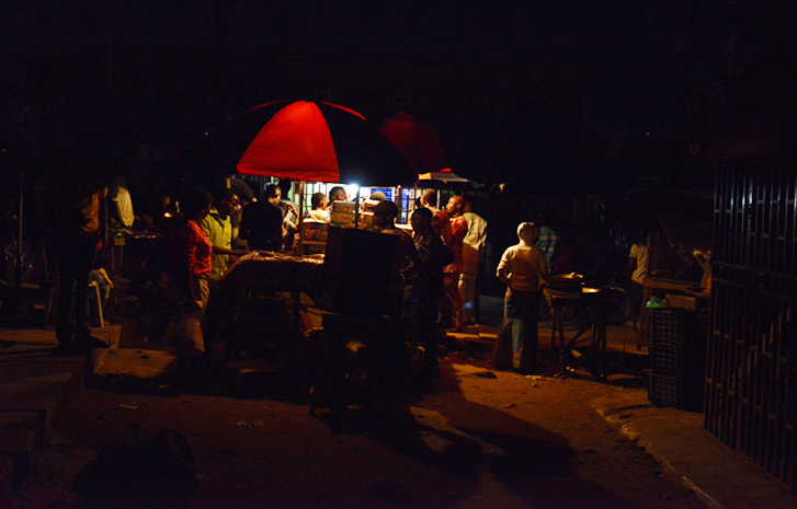 Bread seller lights his stand with small generator at Iyana-Ipaja, Lagos, September 2, 2017.