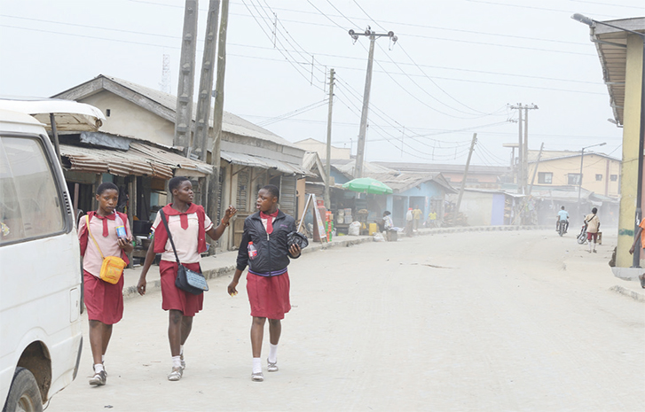 Margaret Ehinmore (middle), with her mates trekking home