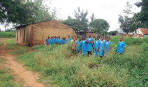 Some pupils of RCM Primary School, Odugbehon, in Agatu LGA standing in their vandalised classroom