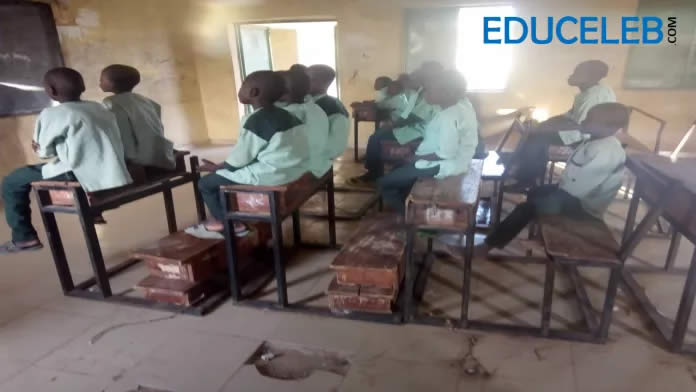 Pupils sit on desks in the absence of benches at the Almajiri Integrated Model Primary School, Tureta in Sokoto State